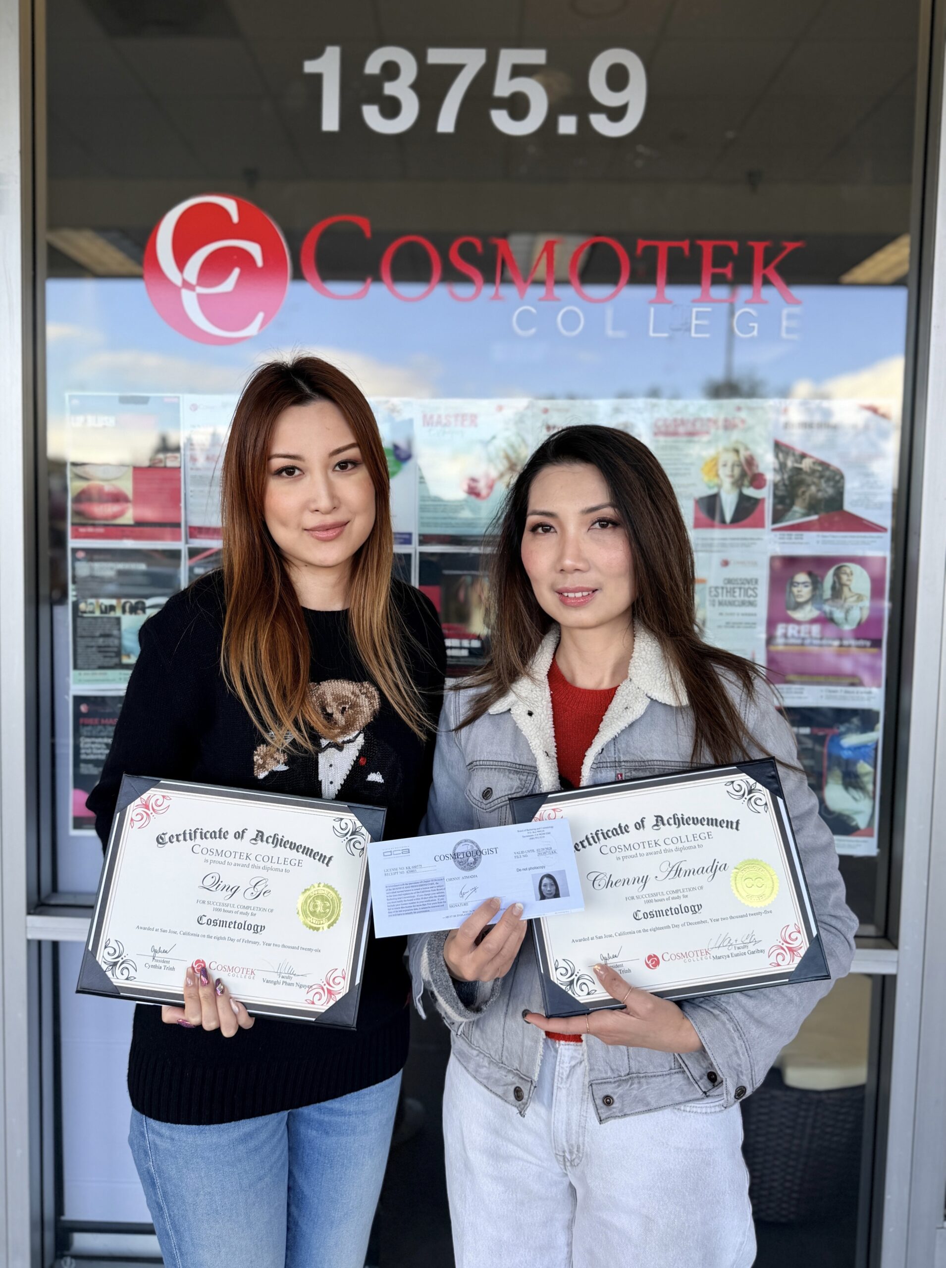 Cosmetology graduate holding scissors