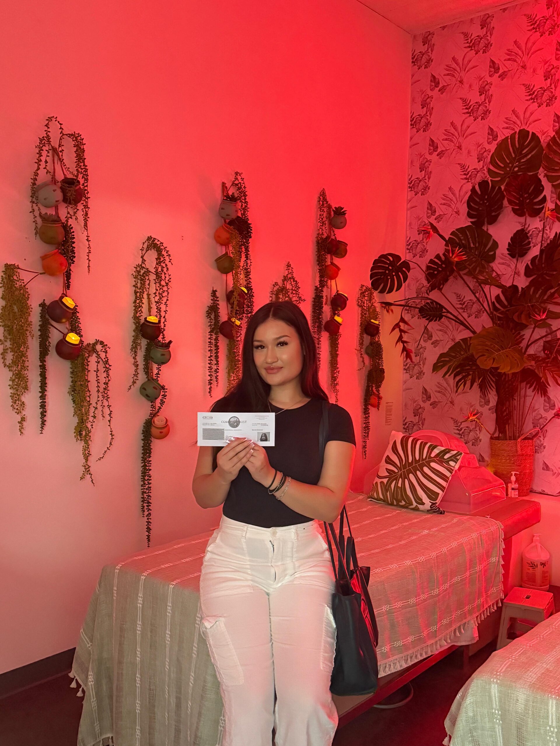 Daija holding her cosmetology license