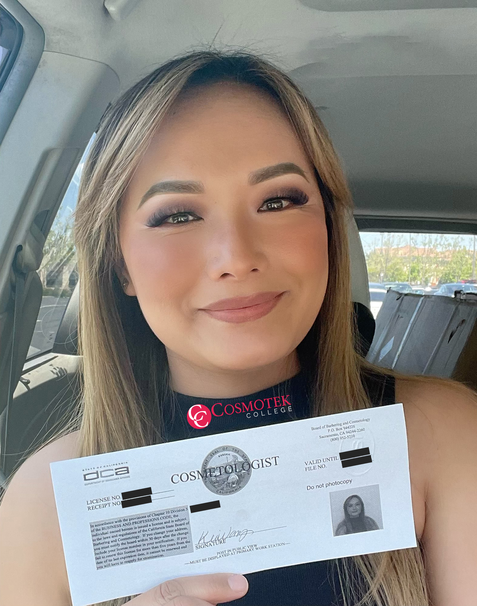 Kia Vang holding her cosmetology license